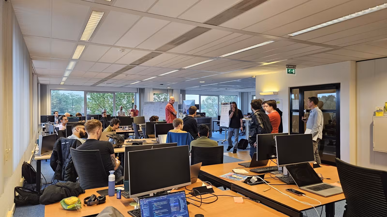 Engineering teams at desks during the two-day on-site migration sprint
